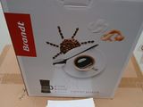 emballage pour une boîte de café sur laquelle figure l'image d'une araignée