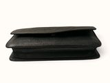 the black leather wallet is open on a white surface