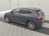 the back of a blue mercedes gle parked in a garage