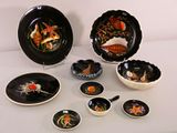 a lot of plates and bowls that are on the table