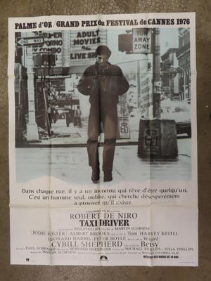a poster of a man walking down the street