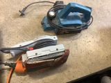 two tools that are sitting on a table
