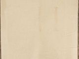 an old piece of paper hanging on a wooden wall