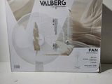 the box is open on a white surface with a picture of a fan in it