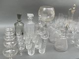 a lot of glass items that are sitting on a table