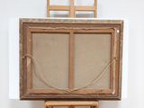 a picture of a painting on a easel in a room