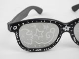 a pair of sunglasses with graffiti on them on a white surface