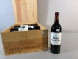 a bottle of wine and a box of wine on a table