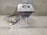 a small machine that is sitting on the ground