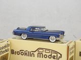 a blue toy car sitting on top of a box