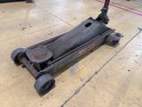a scooter that is sitting on the floor in the garage