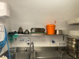 a kitchen with a sink and a stove in it
