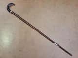 a cane that is sitting on the floor