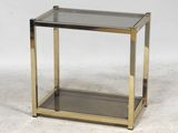 a brass and glass side table with a glass shelf