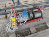 an image of a portable electric winch on a pallet