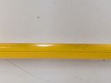 a close up of a yellow door handle on a white wall