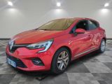 a red car is parked in a room with a checkered floor