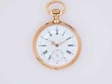a gold pocket watch with roman numerals on it
