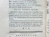 an old book that is open on a table