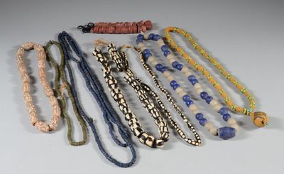 a lot of necklaces that are on a table