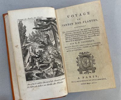 an open book with a picture of a man and a woman sitting on a bench