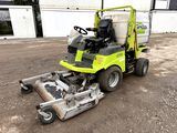 a lawn mower that is sitting in the dirt