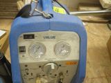 an image of a portable air compressor in a warehouse