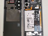 a close up of a cell phone with a broken battery