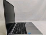an open laptop computer sitting on top of a white surface