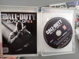 a person holding a game disc in their hand