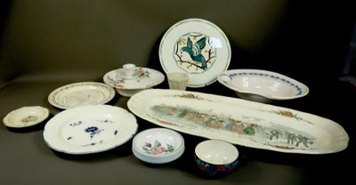 many plates and bowls sitting on a table