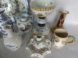 a lot of different vases and bowls on the table
