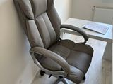 a chair that is sitting in front of a desk