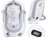 une photo d'un berceau pour bébé équipé d'un thermomètre numérique