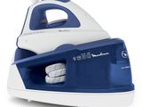 a close up of a blue and white steam iron on a white background