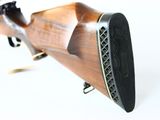 a close up of a rifle on a white background with a white background
