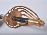 a person that is holding a metal object in their hand