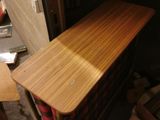a wooden table that is sitting in a room