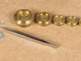 a pair of scissors and a pair of buttons on a table