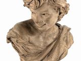 marble bust of a young boy with a hat on his head