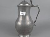 a silver coffee pot with a lid and handle on a grey background