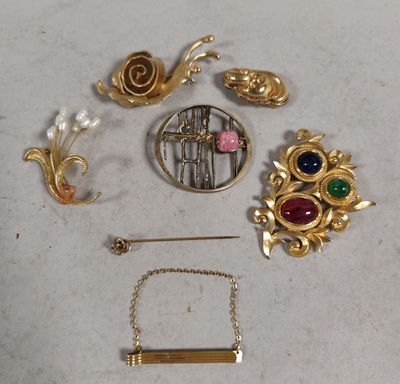 a lot of gold and silver jewelry on a table