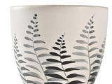 a white bowl with a black and white design on it