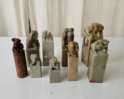 many different types of stone sculptures on a table