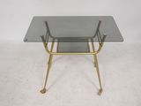 an image of a glass and brass side table with a glass top