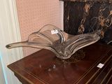 a glass bowl sitting on top of a wooden table