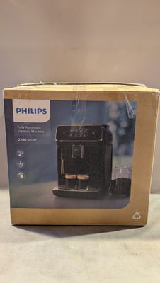Machine à expresso Philips dans son emballage, posée sur une table
