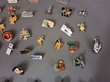 a lot of pins that are on a table