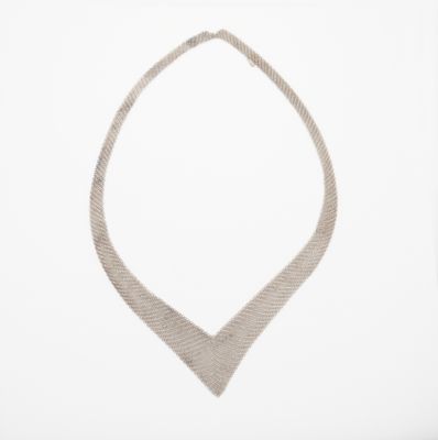 a picture of a silver necklace on a white background