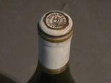 a bottle of wine that is sitting on a table